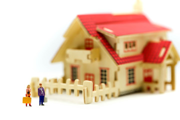 Miniature people : Couple of love with house,Concept for property ladder, mortgage,real estate investment, money