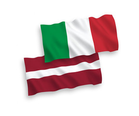 National vector fabric wave flags of Italy and Latvia isolated on white background. 1 to 2 proportion.