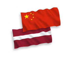 National vector fabric wave flags of Latvia and China isolated on white background 1 to 2 proportion.