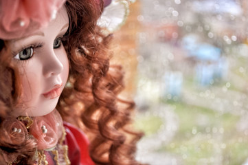 porcelain doll with red curls