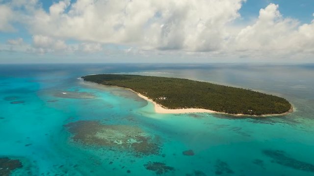 aerial footage tropical island with beach and palm trees lagoon with turquoise water Sea tropical landscape Daco island, Philippines, Siargao. Travel concept Aerial video