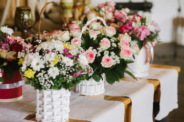 Tables decorayed with flowers on wedding day