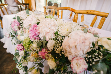 Tables decorayed with flowers on wedding day