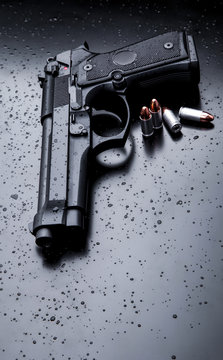 black modern gun on black background. 9mm pistol gun