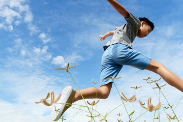 Young boy run and jump