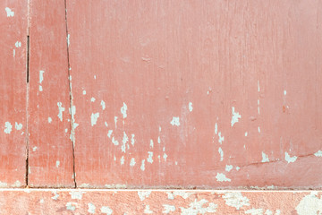 Cracked wall with old layers of paint on the wooden. 