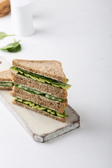 Healthy vegan sandwiches  with green vegetables and greens