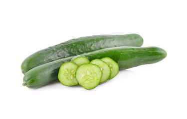whole and sliced fresh Japanese cucumbers on white background