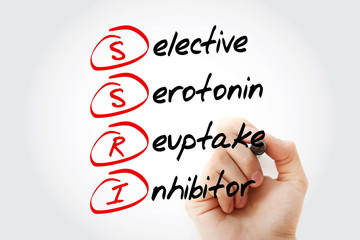 Fototapeta premium SSRI - Selective Serotonin Reuptake Inhibitor acronym with marker, concept background