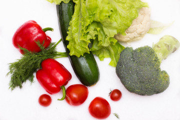 Various vegetables close to a white background