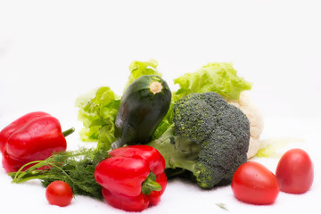 Various vegetables close to a white background