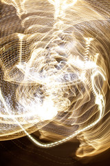 Bulbs glow at night in motion as an abstract background