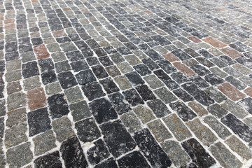 Fototapeta premium The stone blocks cleared of snow as a background