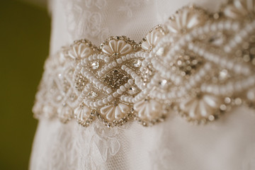 Beautiful tender wedding dress on wedding day close up