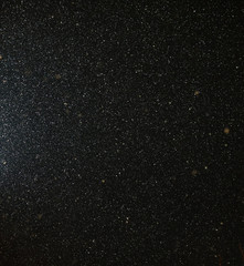 Snow flies in the sky at night as a background