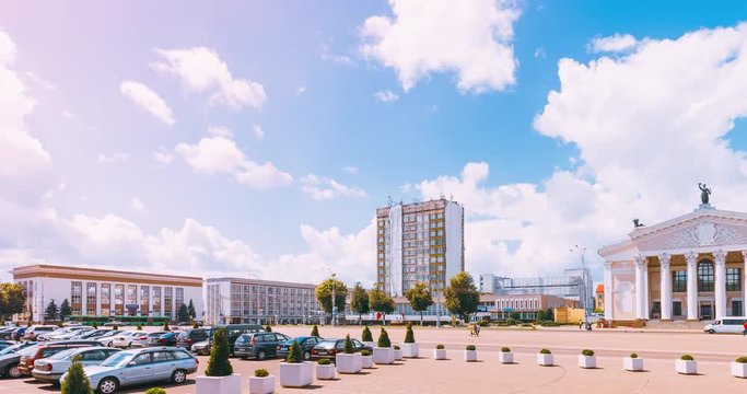 Lenin Square in Gomel with the Dramatic Theater. Bright sunny day in the city with car traffic on the street