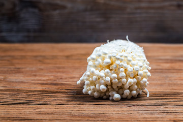 Golden Needle Mushroom ，mushroom from the farm on wooden background