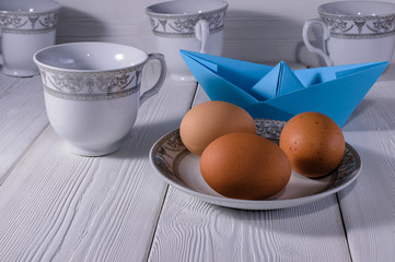 dinner service and unbroken eggs