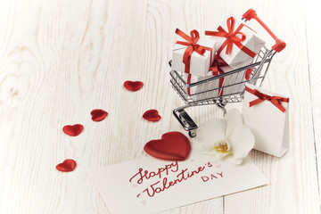 Shopping trolley with gifts. Valentine's day,