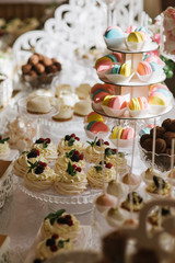 Variety of candies, cakes and cupcakes at the candy bar
