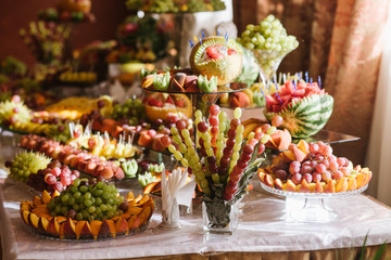Wedding buffet table with different variety of fresh fruits