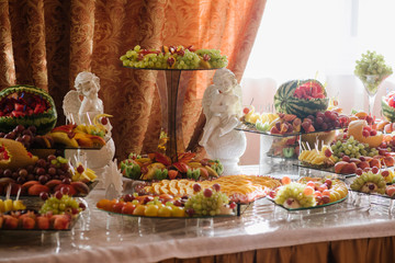 Wedding buffet table with different variety of fresh fruits