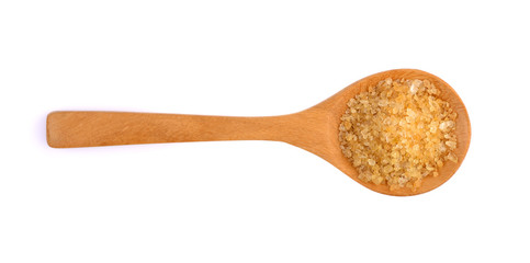 brown sugar in a wooden spoon isolated on white