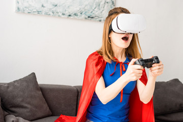 Beautiful mother in virtual reality headset playing video game