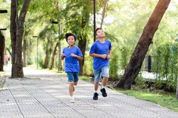 Two Boy running in a park