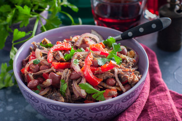 Salad from beef, Bulgarian pepper and beans, salad "Tbilisi", traditional Georgian cuisine, selective focus