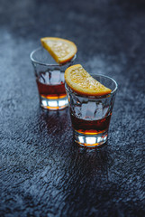 Rum and orange slices sprinkled with cinnamon as a snack