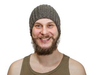 close-up face portrait of smiling happy bearded unshaven guy in hat on an isolated white background