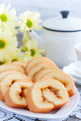 Homemade biscuit roll with apricot jam, selective focus