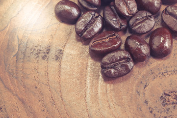 Coffee beans on wooden background 