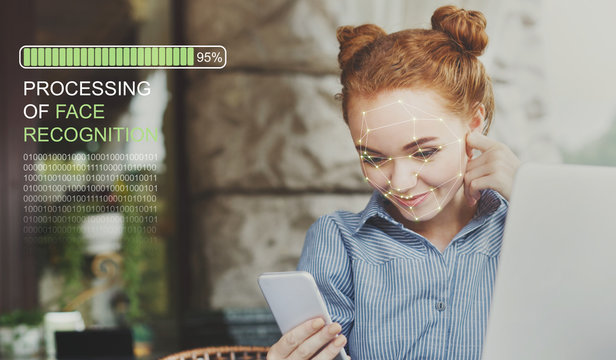 Woman using biometric facial verification on smartphone