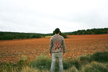 Young man alone and sad in nature