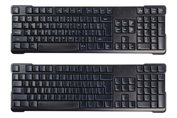 Black plastic wireless computer keyboards with symbols and without isolated on white background. Top view