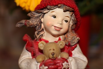 little girl with a toy bear