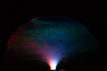 Abstract background a Optical fiber lamp. Closeup of colorful optical fibers