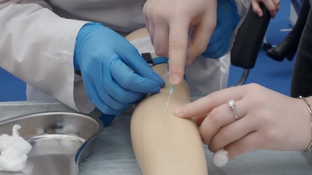 training injection into a vein on a mannequin