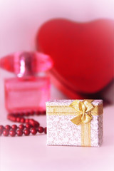 gift in a decorative white box with a gold bow for the holiday of March 8 or Valentine's Day