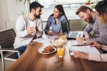 Successful start-up team in training. Business team working on marketing strategy.  Brainstorming meeting concept.