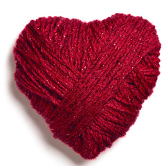 Knitted red wool heart shape isolated on white