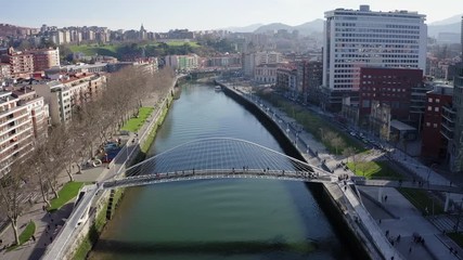 Aerial; drone view of Bilbao capital of Basque country; city panorama with modern architecture and contemporary art objects; new life of ancient city; the combination of old town and modern urbanism
