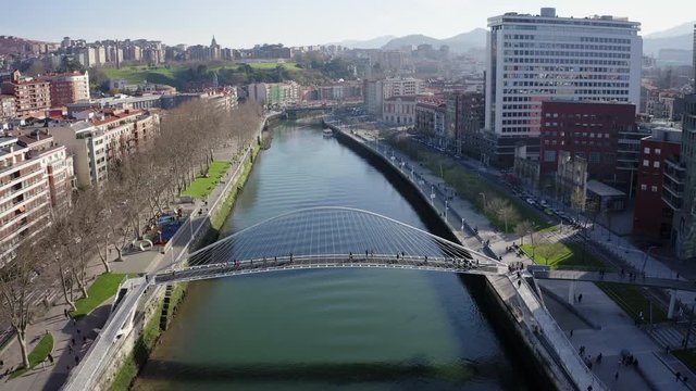 Aerial; drone view of Bilbao capital of Basque country; city panorama with modern architecture and contemporary art objects; new life of ancient city; the combination of old town and modern urbanism
