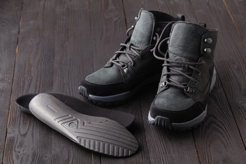 Warm shoes and orthopedic insoles. Winter background, footwear