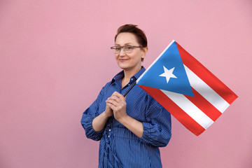Puerto Rico flag. Woman holding Puerto Rican flag. Nice portrait of middle aged lady 40 50 years...