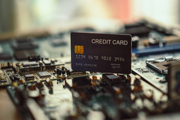 Fototapeta na wymiar Technology credit card on mainboard. - Image