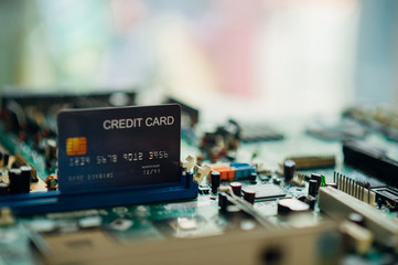 Fototapeta na wymiar Technology credit card on mainboard. - Image