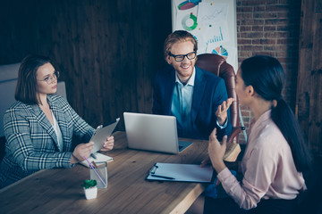 Three nice chic stylish trendy elegant cheerful business sharks discussing strategy profit growth plan economy appointment at industrial loft interior work place station